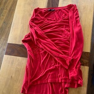 Red long sleeve pocket shirt.